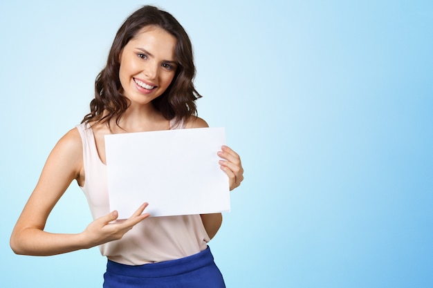 Woman holding blank card.