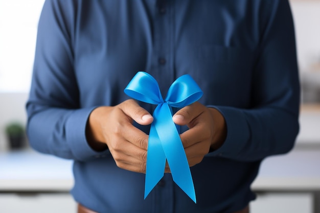 Woman holding a blue ribbon with copy space for your text or product