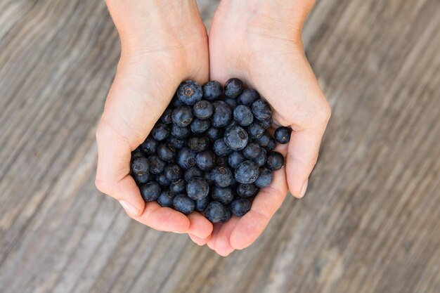 Woman holding blueberries