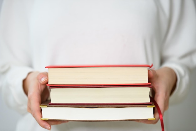 A woman holding a book for reading