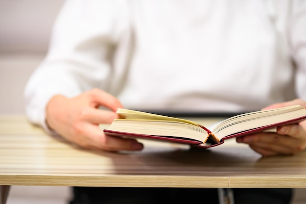 A woman holding a book for reading