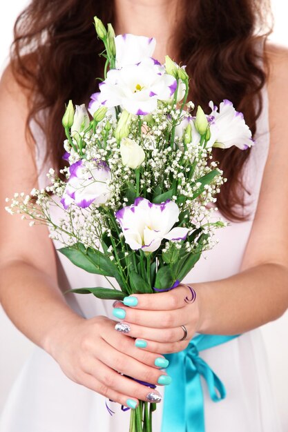 Woman holding bouquet closeup