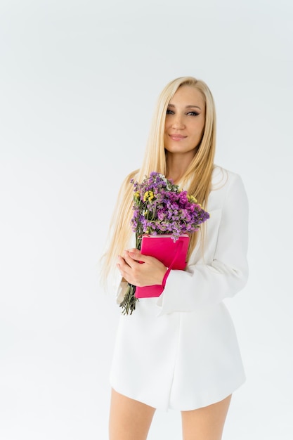 A woman holding a bouquet of flowers