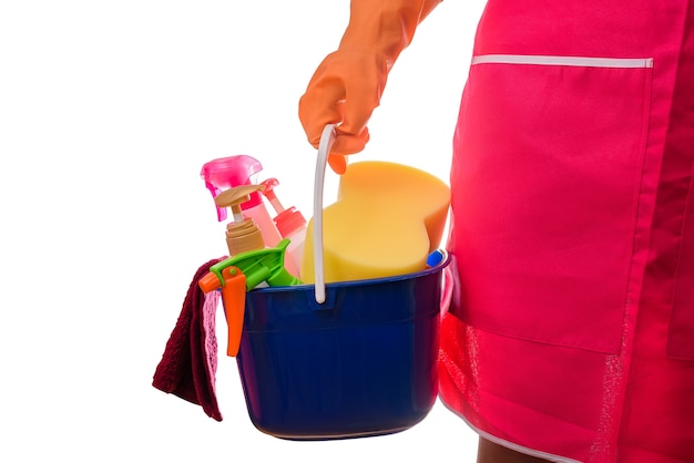 woman holding a bucket full of cleaning supplies isolated on white background
