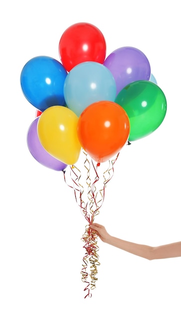 Woman holding bunch of bright balloons on white background closeup