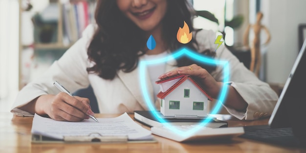 A woman holding and checking house model Real Estate House Appraisal And Inspection and Insurance concept