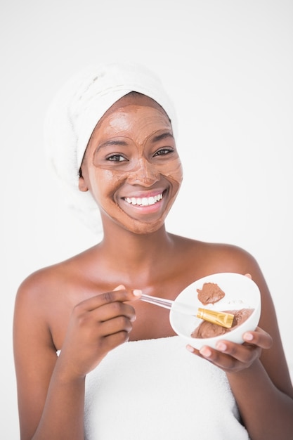 Woman holding a chocolate bowl at spa center