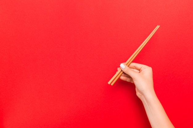 Woman holding chopsticks