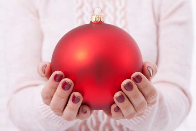 Woman holding Christmas ball