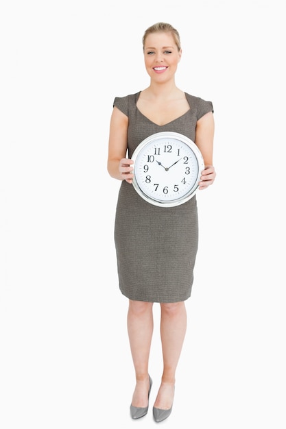 Woman holding a clock