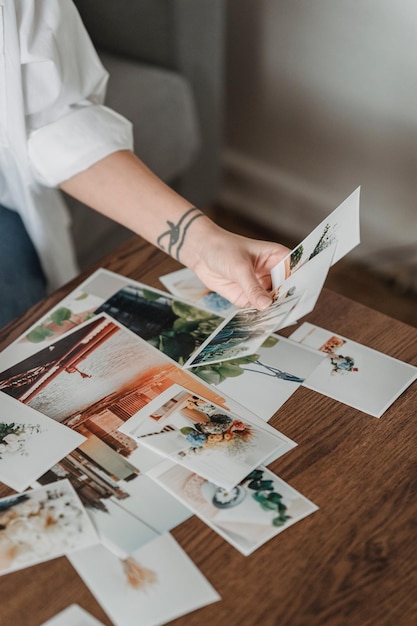 Woman holding a collection of old photographs,