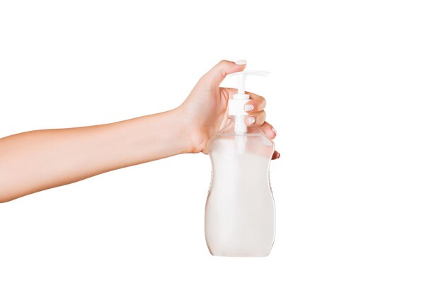 Photo woman holding cream bottle against white background beauty concept