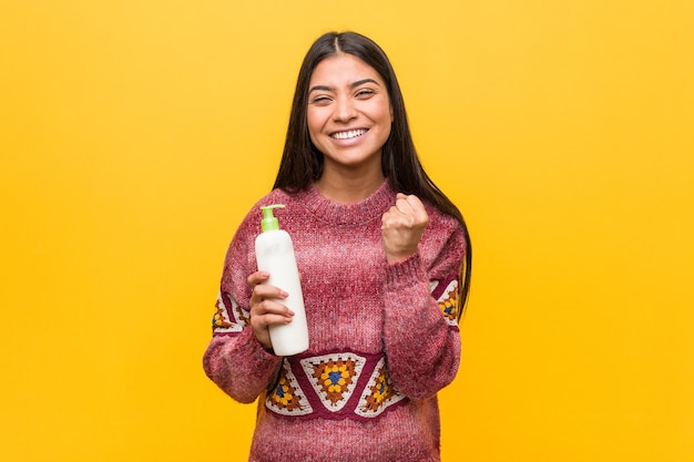 Woman holding a cream bottle