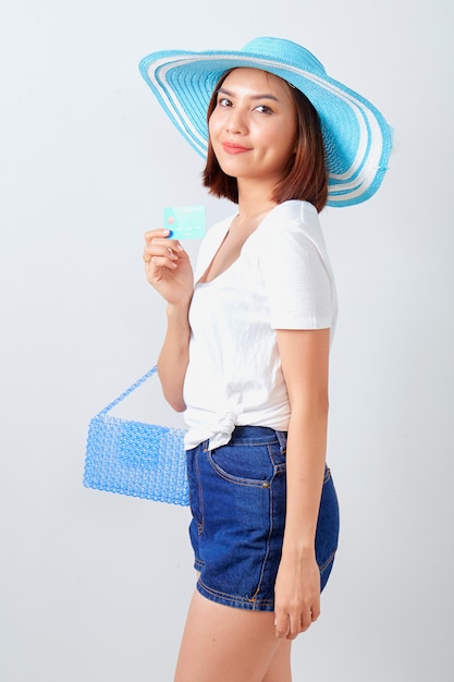 Woman holding Credit card summer holiday