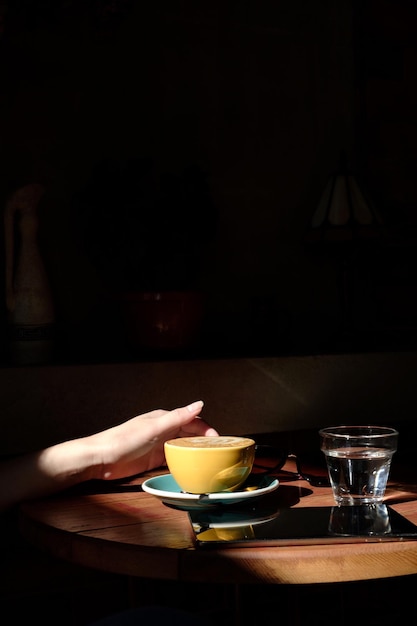 woman holding cup of coffee