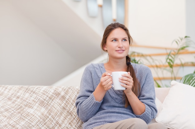 Woman holding a cup of coffee