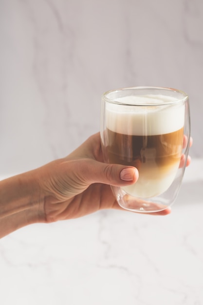 Woman holding a cup of coffee