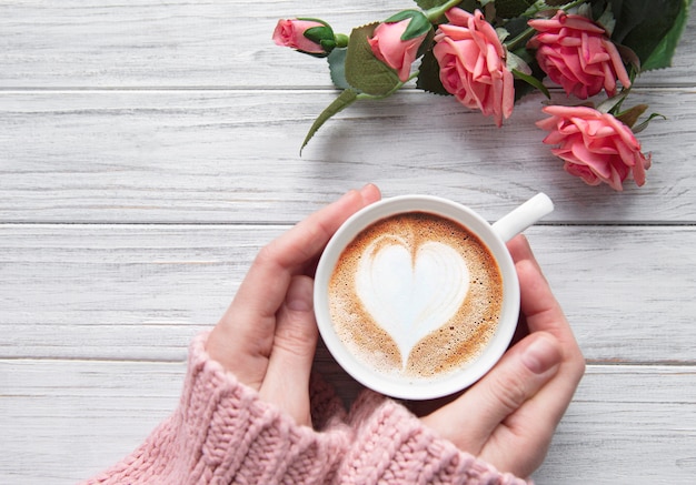 Woman holding cup of coffee