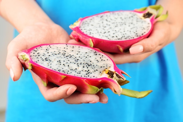 Woman holding dragon fruit