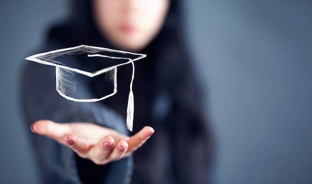 Woman holding education success icon