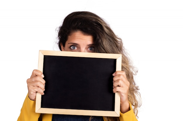 Woman holding an empty chalkboard