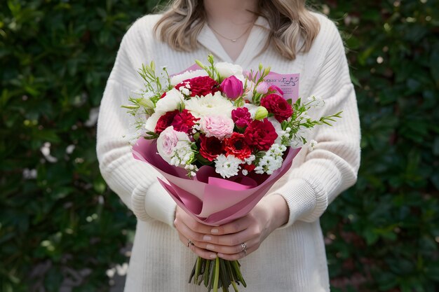 Woman holding a flower bouquet captures Mothers Day essence