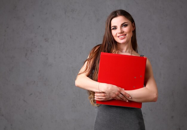 Woman holding folder in hand