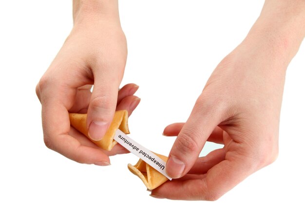 woman holding fortune cookie isolated on white