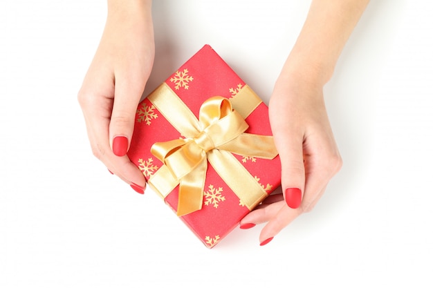 Woman holding gift box isolated on white