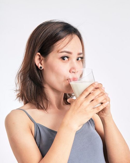 Woman holding a glass of milk