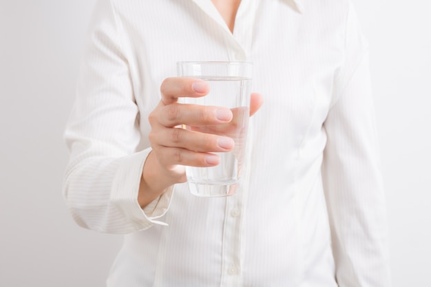 Woman holding a glass of water