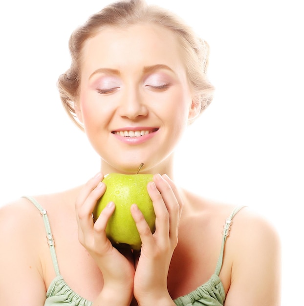 Woman holding green apple