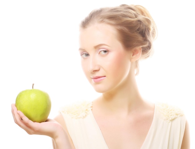 Woman holding green apple