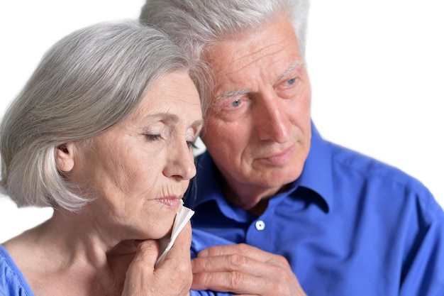 Woman holding hand on cheek