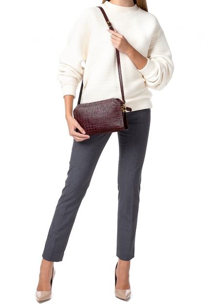 Photo woman holding a handbag isolated on white background