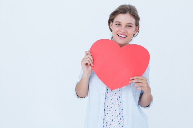 Woman holding heart card 