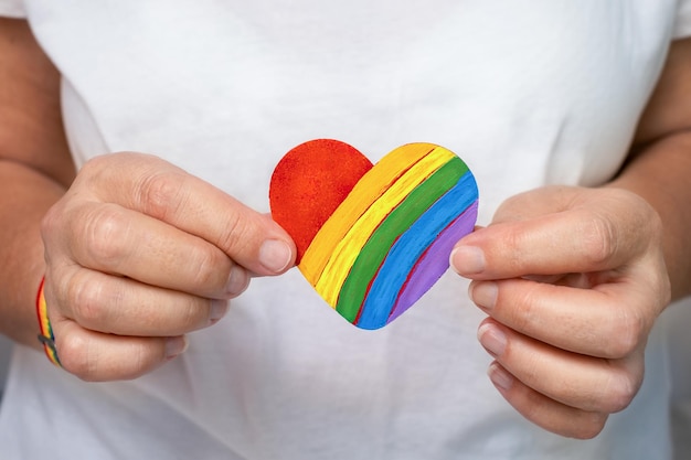 Woman holding a heart LGBT