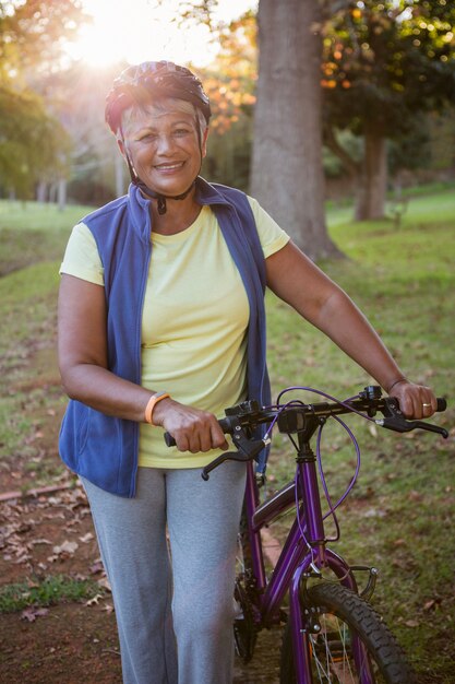 Woman holding her bike