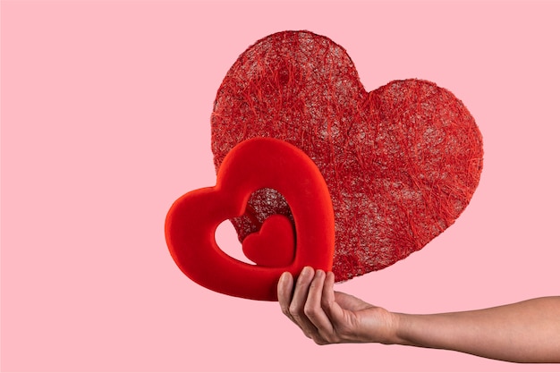 Photo woman holding in her hands two hearts. valentines day concept