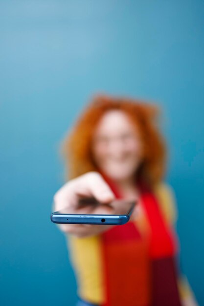 A woman holding her new smartphone