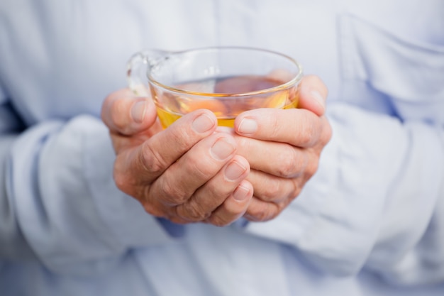 Woman holding herbal tea