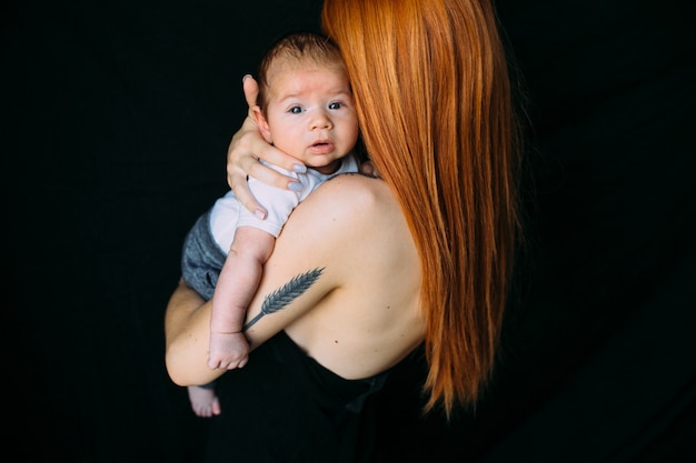 Woman holding infant son