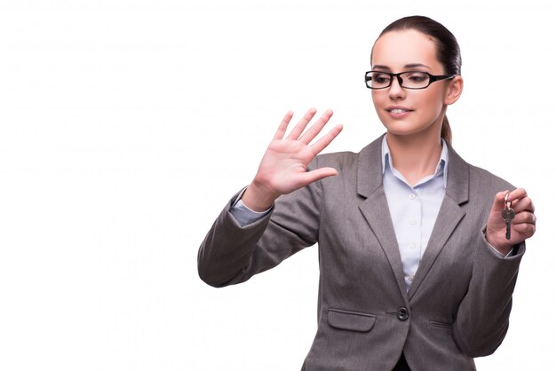 Woman holding keys in real estate concept