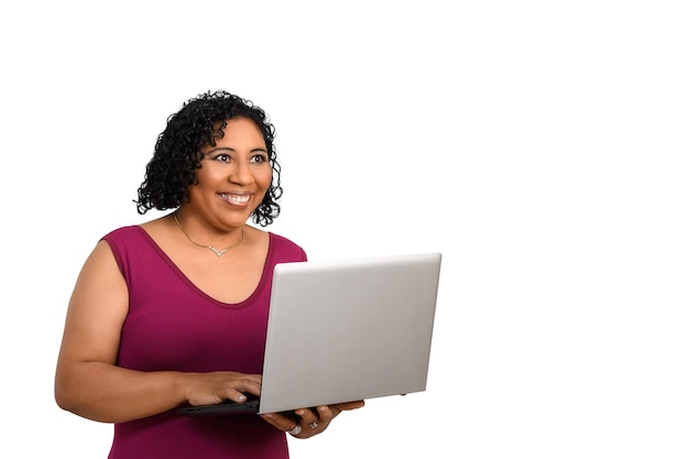 woman holding laptop computer while typing on keyboard on white background