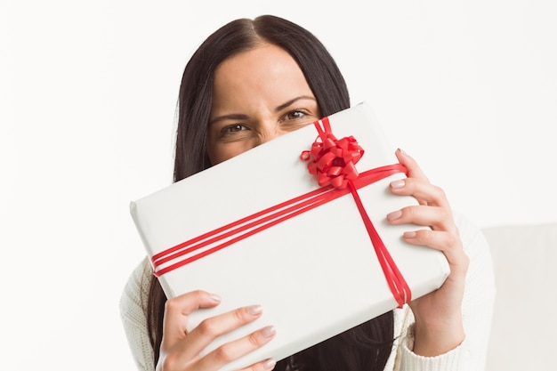 Woman holding a large present