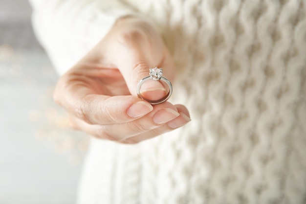 Woman holding luxury engagement ring closeup