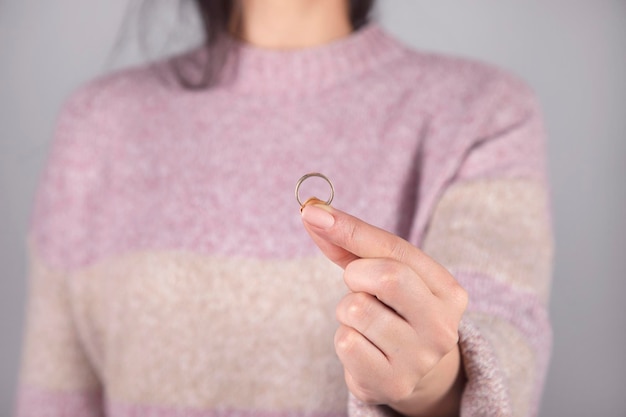 Woman holding married ring