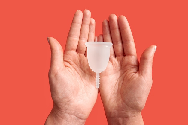 Woman holding menstrual cup