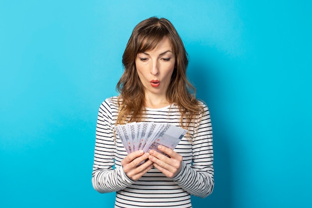 Woman holding money in her hands