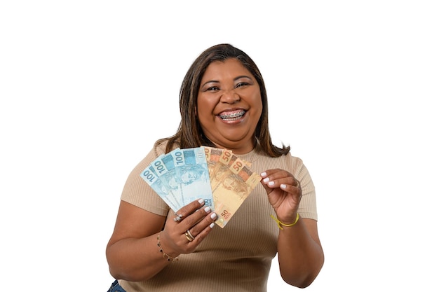 woman holding money smiling woman holding Brazilian money on white background